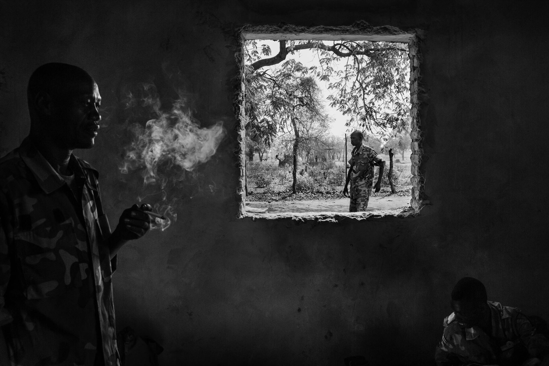 Fabio Bucciarelli, <i>A Sudan People's Liberation Army (SPLA) government soldier smokes a cigarette at the SPLA headquarters in Nyang</i><br>Yirol East Country, South Sudan on February 15, 2014